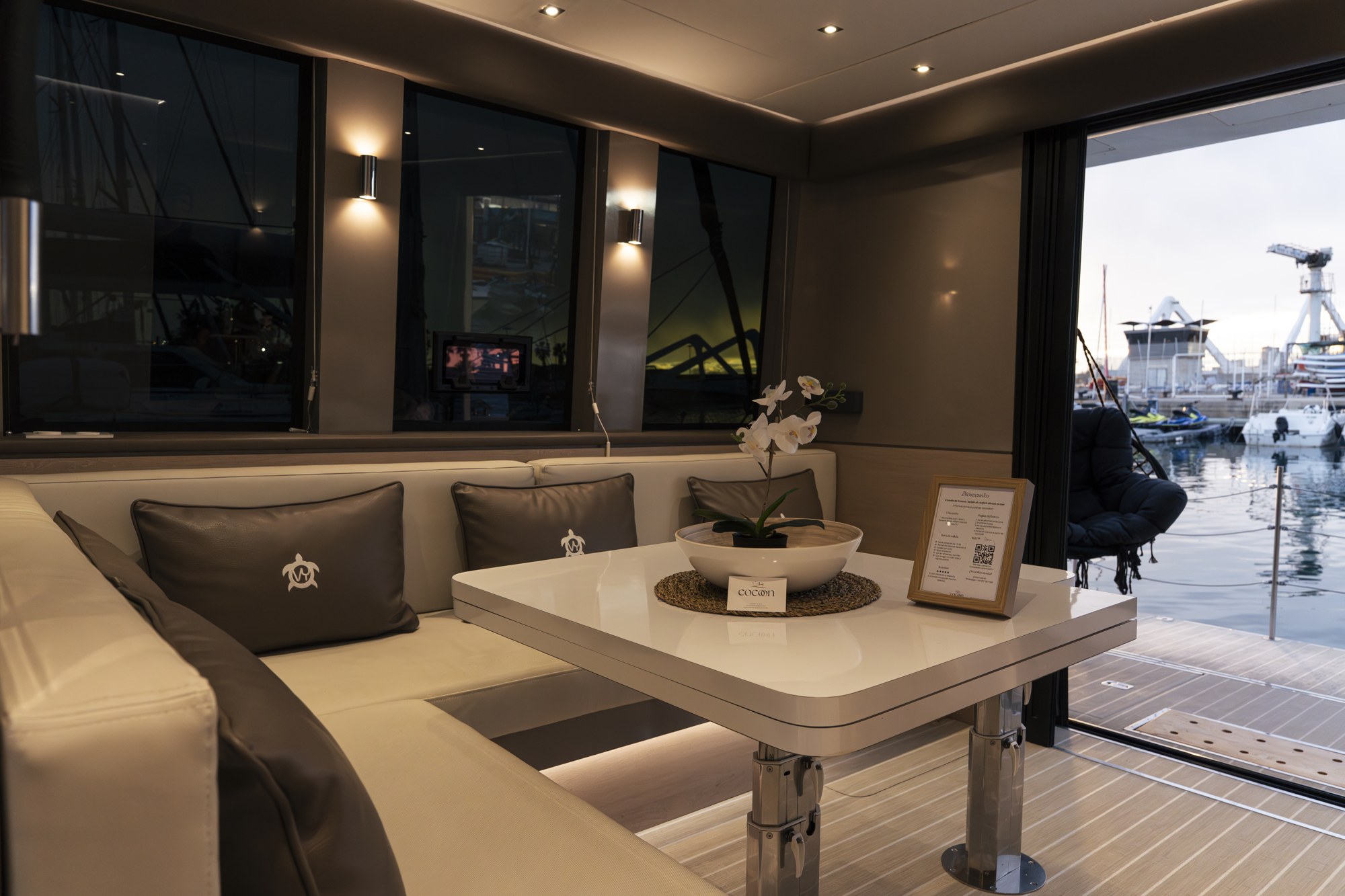 The principal lounge view, open to the terrace and linked to the galley.